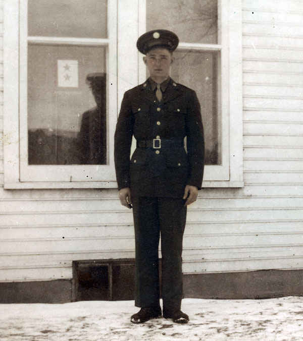 Picture of my grandfather before he left for Europe on January 18, 1945. Notice the flag in the window, each star stood for a soldier in the war. One for him and one for his brother Donald. The flag was known as the 