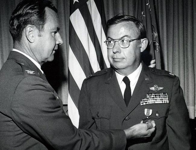Receiving the Meritorious Service Medal from the Vice Commander of the Air War College, Maxwell AFB, AL in 1973