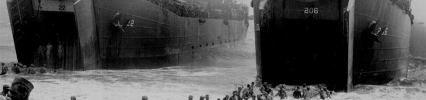 Two Coast Guard-manned LST's open their great jaws in the surf that washes on Leyte Island beach