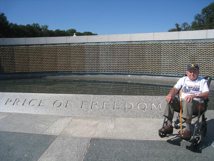 Bob Lamp remembers "the price of freedom" at the World War II Memorial's Wall of 4,000 Stars representing and honoring the 400,000 men and women who lost their lives defending our nation in battle.