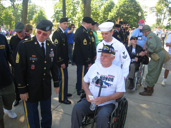 WW II Veteran Bob Hickman gets a hero's welcome and military + civilian greeting line as he enters the World War II Memorial in Washington, D.C.