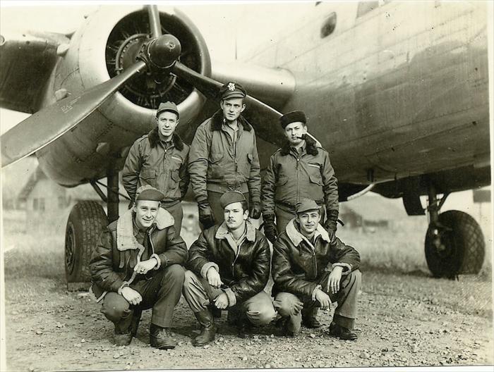 photo of boys from Birmingham Alabama in front of a B-25 from their squadron