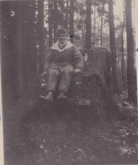 John Tubinis, PFC, 1st ID HQ CO, on maneuver, Germany.  Sitting on top of a jeep.  1951-1953.