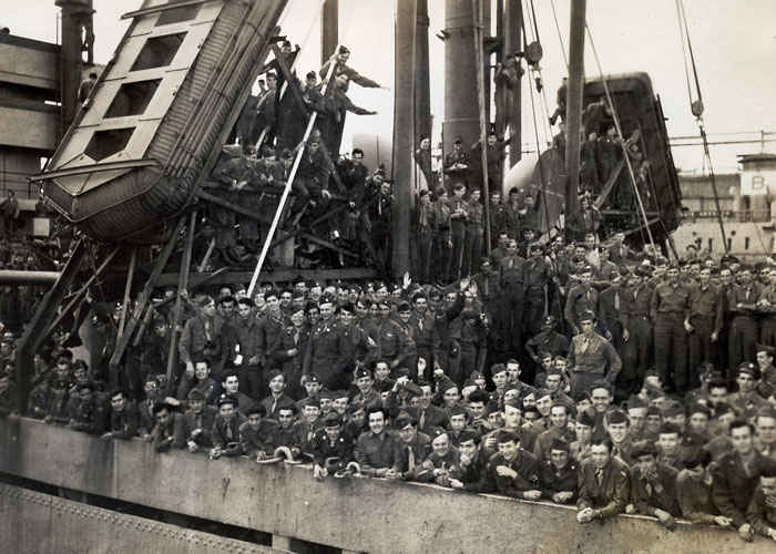 Picture of the Westminster Victory, this is the ship my grandfather rode back on from Europe to New York City. Go up about two inches from the bottom and one inch from the right and you can see him marked with a dot. When one got off the boat there were photographers and the soldiers would give them money to mail the photos to their home.