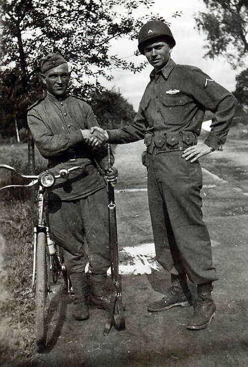 Russian soldier to the left near the American-Russian lines.