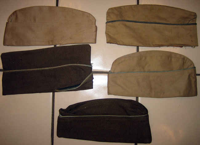 Various colors of army hats worn by my grandfather.