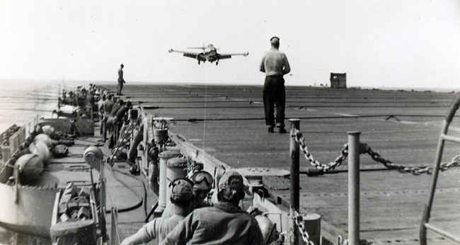 Grumman F9F Panther is about ready to grab a wire on the deck of the Boxer. It was the most widely used jet fighter of the Korean War by the Navy.