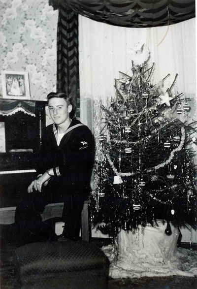 Ellis Gene Buettner on leave from the Navy and home for Christmas.