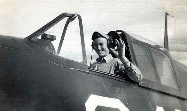 Ellis G Buettner at the flight controls of a Hellcat.