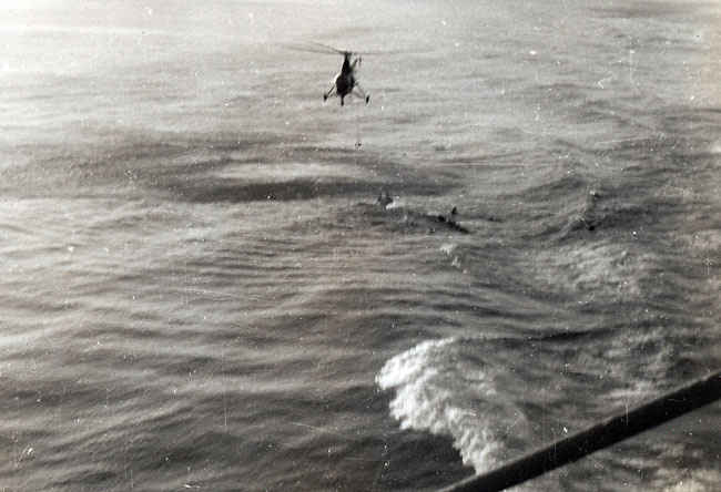 Pilot in the drink after having to bailout. Pilot was safely rescued by the Boxer.