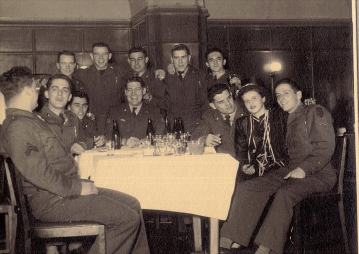 Dad, (John Tubinis), second left, with 1st I.D. HQ CO men at Service Club.  Most likely Darmstadt, Germany 1951.  Smitty with his arm draped around soldiers.
