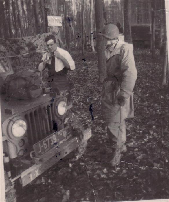 John Tubinis, PFC, 1st I.D. HQ CO, (right) and Lt. Charles Grimsley shaving. Taken on a maneuver in Germany. 1951-1953.