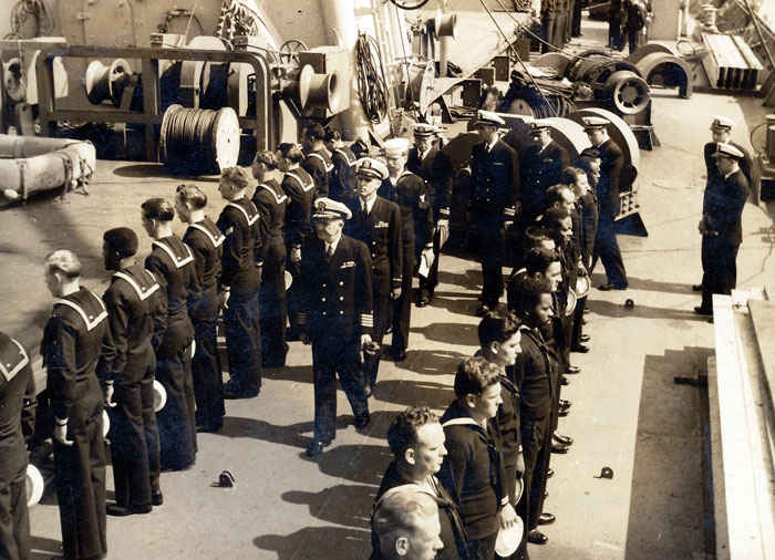 I think this is one of the coolest pictures. Look in the middle of the picture front, it is the captain, then look 2 people behind him, that is my grandfather. He followed the captain around everywhere and he was not kidding.