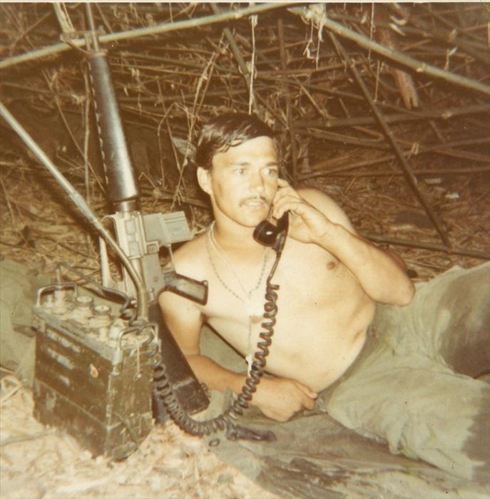 Eldon with his M-16 and PRC-25 Radio. The "prick"  was developed in the 1950's. Normal range was of 5 kilometers with the short antenna, up to 8 kilometers long antenna and was powered by a battery that could last about 20 hours.