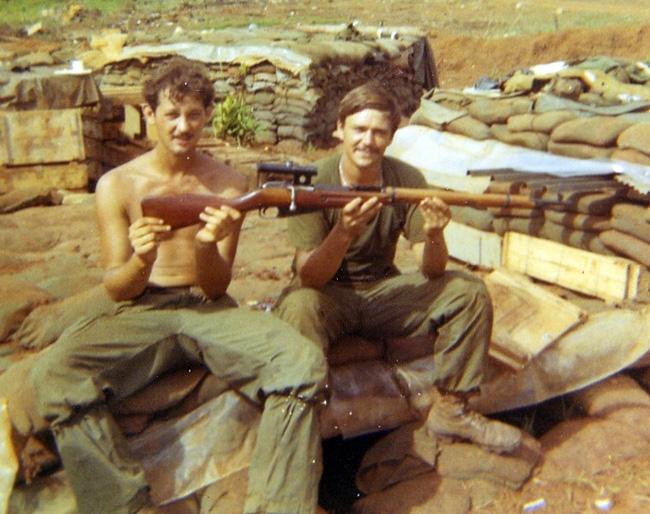Russian sniper rifle Eldon (right) received for being awarded a purple heart. The rifle was captured during the Cambodian raid.