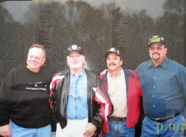 Eldon (3rd left) and Mac Coffman (2nd left) at the Vietnam wall.