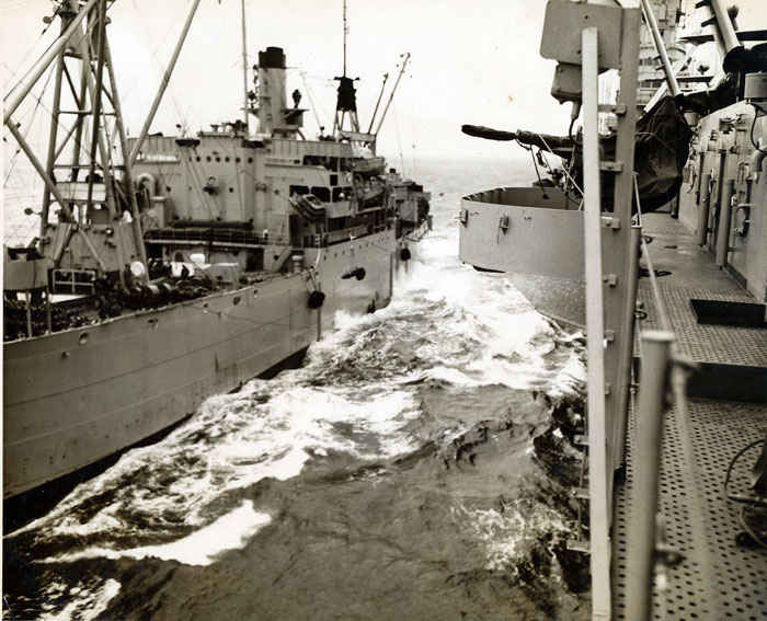 Loading ships full of ammunition at sea was never, a routine task as one can see in this picture, a disaster could happen at anytime via a rogue wave, wind or complacency.
