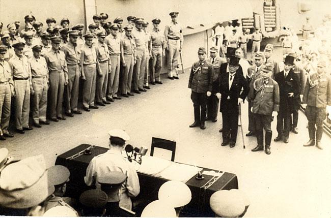 September 2, 1945 Emperor Hirohito signing th September 2, 1945 Emperor Hirohito signing the document for Japan to formally surrender on the battleship USS Missouri, anchored in Tokyo Bay.
