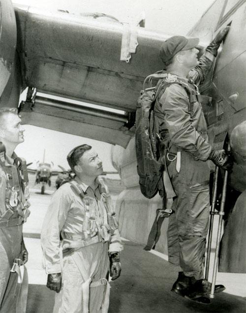 Entering RB-26C, over the wing to the cockpit.  Dave, Morris Briggs,  and Paul