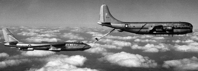 Pix taken from chase airplane showing B-47 taking on fuel from KC-97.