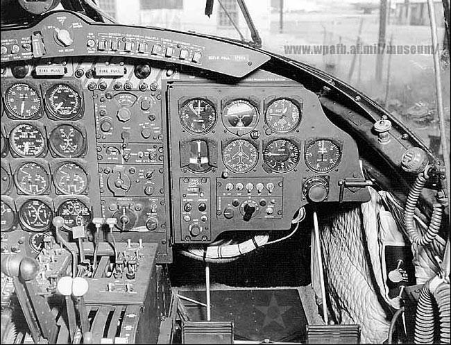 The right side of the cockpit of an RB-26C aircraft. Tunnel to the nose section is below the instrument panel.