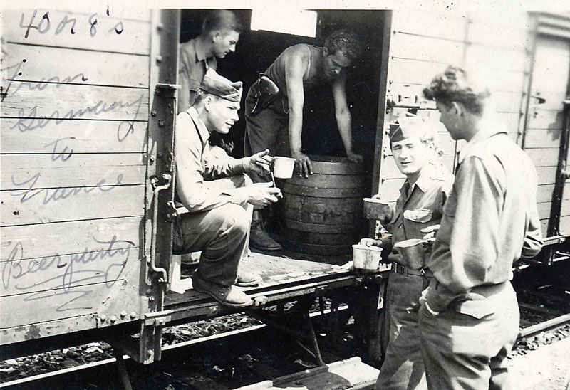 Beer party from Germany to France. This train car is known as the 40's or 8's, which means it, could haul 40 men or 8 horses.