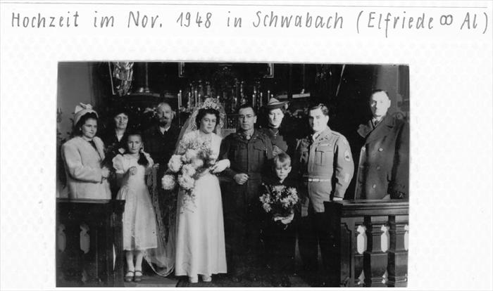 Oma and my Grandfather posing with the Wedding Party, circa 1948.